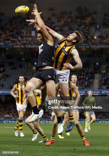 Kaiden Brand of the Hawks and Levi Casboult of the Blues compete for the ball during the 2018 AFL round 18 match between the Carlton Blues and the...