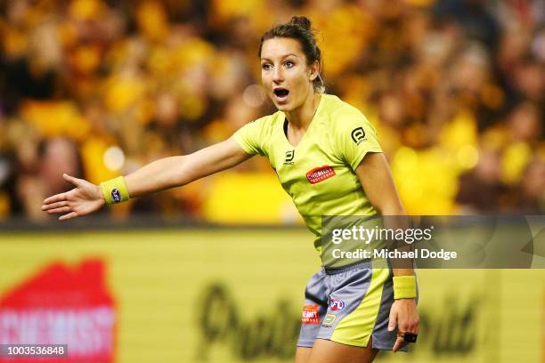 The first female AFL umpire, Ellen Glouftsis, officiates during the round 18 AFL match between the Carlton Blues and the Hawthorn Hawks at Etihad...