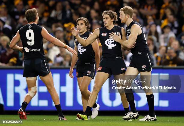 Charlie Curnow of the Blues celebrates a goal with L-R Patrick Cripps, Cameron Polson and Matthew Lobbe of the Blues during the 2018 AFL round 18...