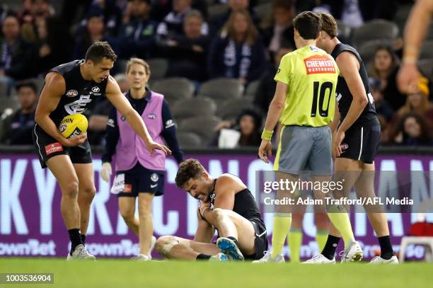 Levi Casboult of the Blues is seen sore after a heavy knock during the 2018 AFL round 18 match between the Carlton Blues and the Hawthorn Hawks at...