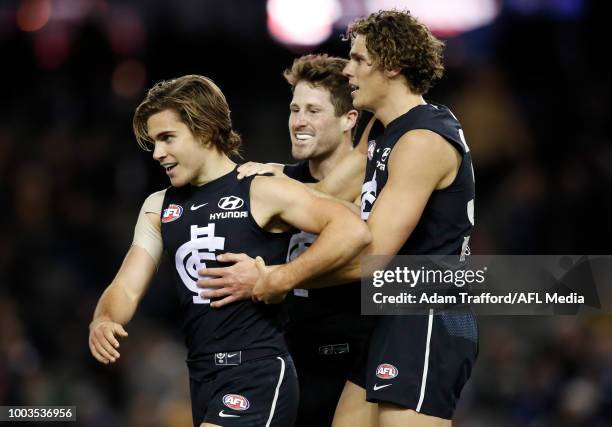 Cameron Polson of the Blues celebrates his first AFL goal with Matthew Wright and Charlie Curnow of the Blues during the 2018 AFL round 18 match...