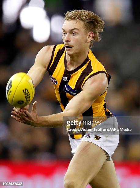 James Worpel of the Hawks handpasses the ball during the 2018 AFL round 18 match between the Carlton Blues and the Hawthorn Hawks at Etihad Stadium...