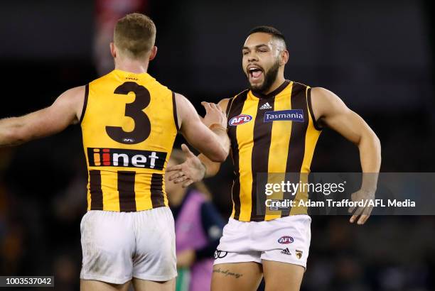 Jarman Impey of the Hawks congratulates Tom Mitchell of the Hawks on a goal during the 2018 AFL round 18 match between the Carlton Blues and the...