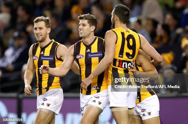 Luke Breust of the Hawks celebrates a goal with Jonathan O'Rourke and Jack Gunston of the Hawks during the 2018 AFL round 18 match between the...