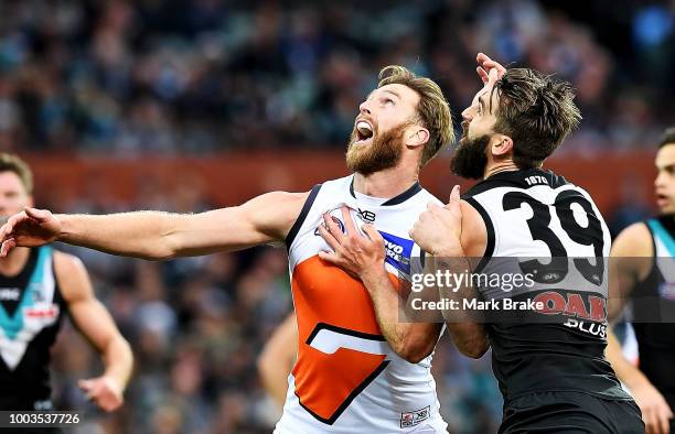 Dawson Simpson of the Giants ruccks against Justin Westhoff of Port Adelaide during the round 18 AFL match between the Port Adelaide Power and the...