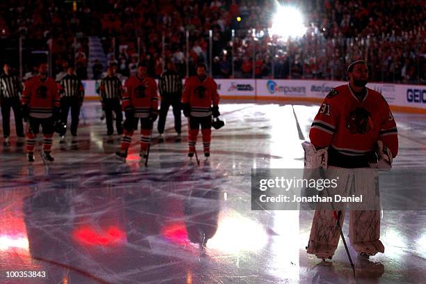 Goaltender Antti Niemi of the Chicago Blackhawks looks on during the national anthem before the Blackhawks take on the San Jose Sharks in the first...