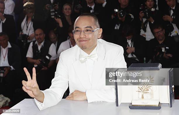 Director Apichatpong Weerasethakul poses with his Palme d'Or award for the film "Uncle Boonmee Who Can Recall His Past Lives" at the Palme d'Or Award...