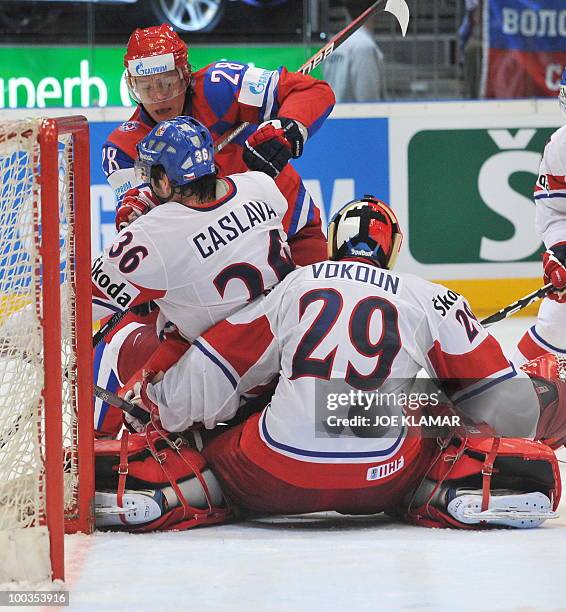 Russia's Alexander Semin attempts to get past and Czech Republic's goalkeepr Tomas Vokoun and Petr Caslava during the IIHF Ice Hockey World...