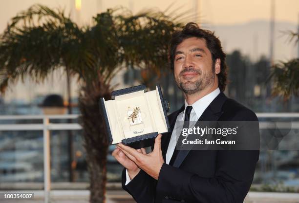 Actor Javier Bardem poses with his Best Actor award for his role in 'Biutiful'' during the Palme d'Or Award Ceremony photocall held at the Palais des...