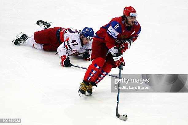 Alexander Ovechkin of Russia is challenged by Petr Koukal of Czech Republic during the IIHF World Championship gold medal match between Russia and...