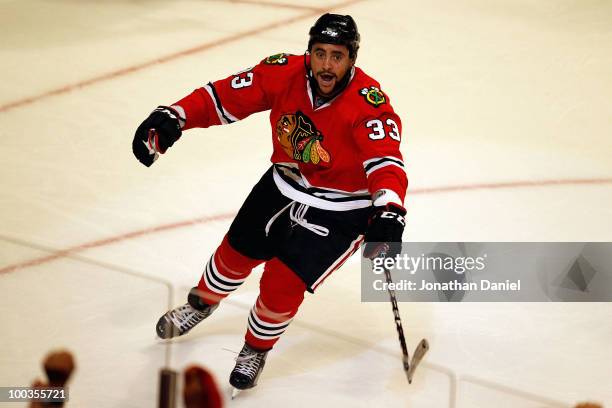 Dustin Byfuglien of the Chicago Blackhawks celebrates his third period goal while taking on the San Jose Sharks in Game Four of the Western...