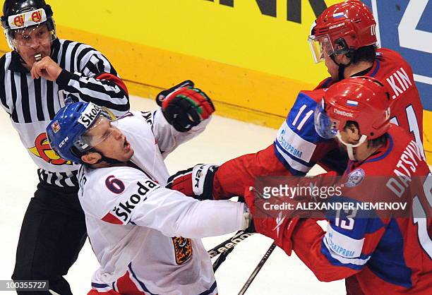 Russian Evgeni Malkin of NHL's Pittsburgh Penguins and Pavel Datsuk of NHL's Detroit Red Wings fights with Czech Tomas Mojzis during the IIHF Ice...
