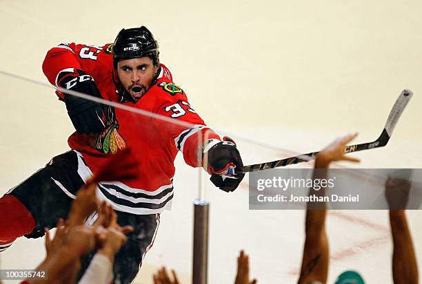 Dustin Byfuglien of the Chicago Blackhawks celebrates his third period goal while taking on the San Jose Sharks in Game Four of the Western...
