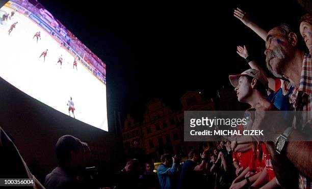Czech fans watch on a giant screen the IIHF Ice Hockey World Championship final match Russia vs Czech Republic at the Old Town Square on May 23, 2010...