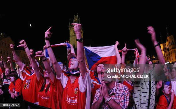 Czech fans cheer for their national ice hockey team during the screening of the IIHF Ice Hockey World Championship final match Russia vs Czech...