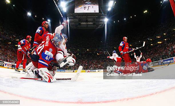 Jakub Klepis of Czech Republic scores his team's opening over Semyon Varlamov, goalkeeper of Russia goal during the IIHF World Championship gold...