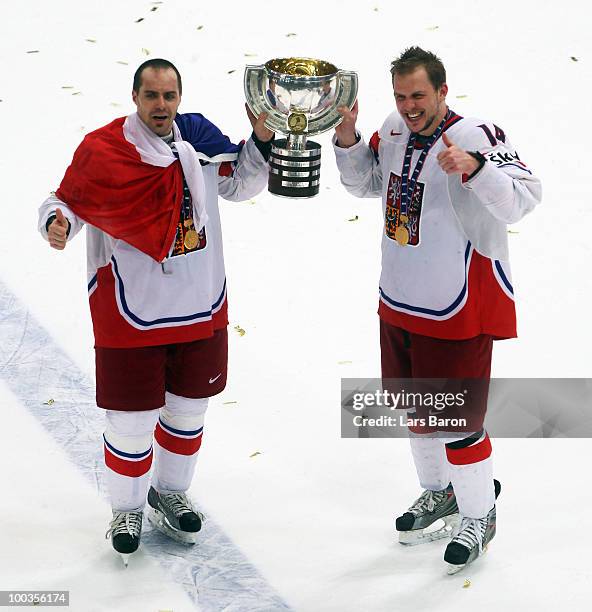 Tomas Rolinek of Czech Republic lifts the trophy with team mate Petr Vampola after winning the IIHF World Championship gold medal match between...