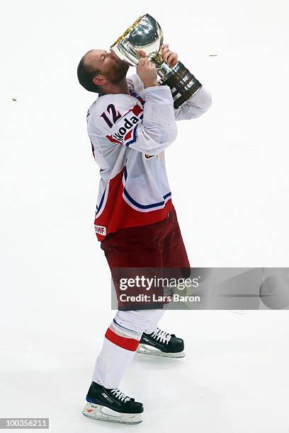 Jiri Novotny of Czech Republic kisses the trophy after winning the IIHF World Championship gold medal match between Russia and Czech Republic at...