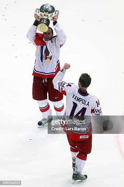 Tomas Rolinek of Czech Republic lifts the trophy and celebrates with team mate Petr Vampola after winning the IIHF World Championship gold medal...