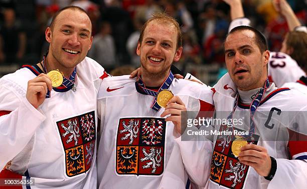 Karel Rachunek, Miroslav Blatak and Tomas Rolinek of Czech Republic celebrate with the gold medal after winning the IIHF World Championship gold...