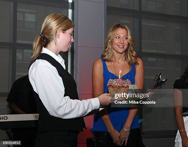 Singer Colbie Caillat blows out a birthday cake at the VH1 Save The Music Foundation Summer Kick-Off Party benefit at the W Hoboken on May 23, 2010...