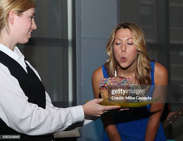 Singer Colbie Caillat blows out a birthday cake at the VH1 Save The Music Foundation Summer Kick-Off Party benefit at the W Hoboken on May 23, 2010...