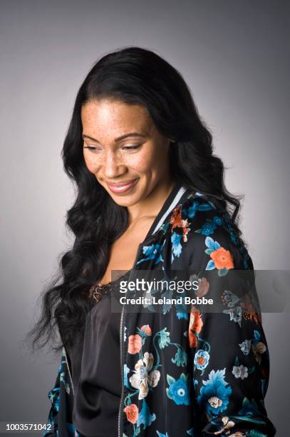 portrait of mixed race woman with freckles and long black hair - omlaag kijken stockfoto's en -beelden