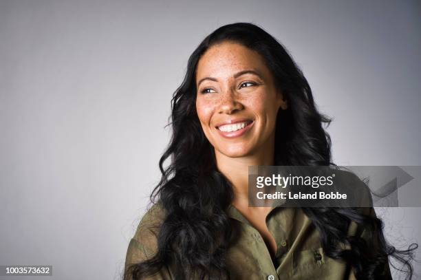 portrait of mixed race woman with freckles and long hair - looking away stock pictures, royalty-free photos & images