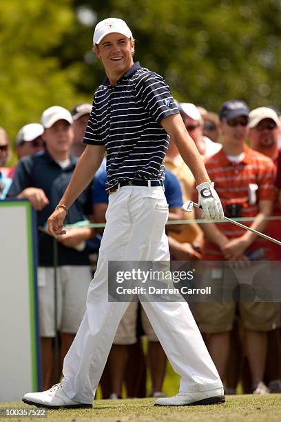 Jordan Spieth smiles in reaction to a tee shot during the fourth round of the HP Byron Nelson Championship at TPC Four Seasons Resort Las Colinas on...