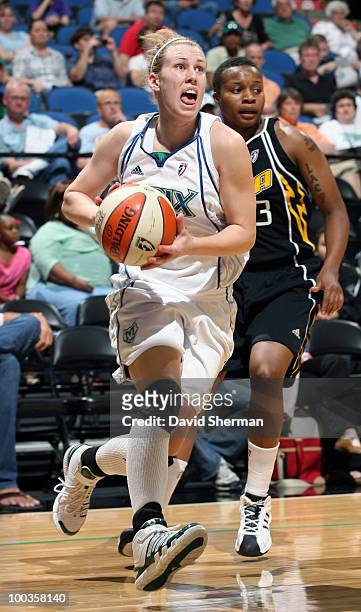 Gabriela Marginean of the Minnesota Lynx drives to the basket against Natasha Lacy of the Tulsa Shock during the game on May 23, 2010 at the Target...