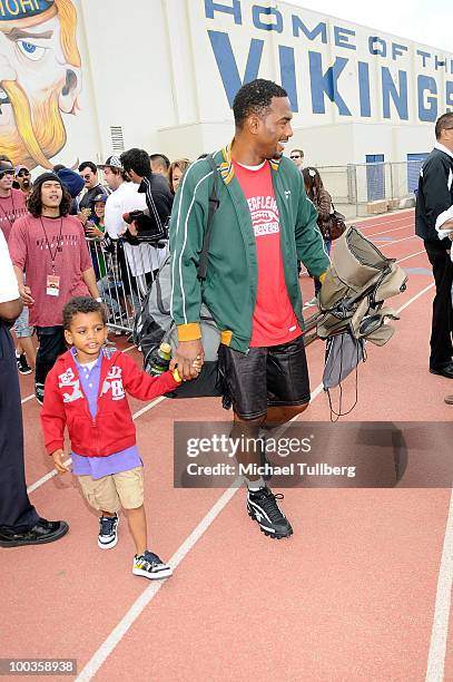 Actor Bill Bellamy arrives with son Baron at the NFL Players Premiere League Flag Football Tournament and Skills Challenge on May 23, 2010 in Santa...