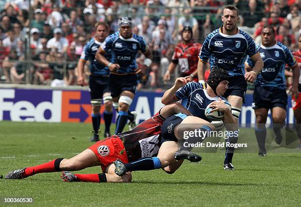 Leigh Halfpenny of Cardiff is tackled during the Amlin Challenge Cup Final between Toulon and Cardiff Blues at Stade Velodrome on May 23, 2010 in...