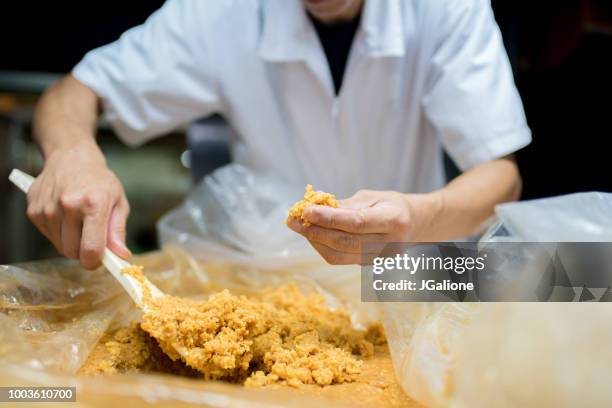 japanese worker inspecting miso - miso sauce stock pictures, royalty-free photos & images