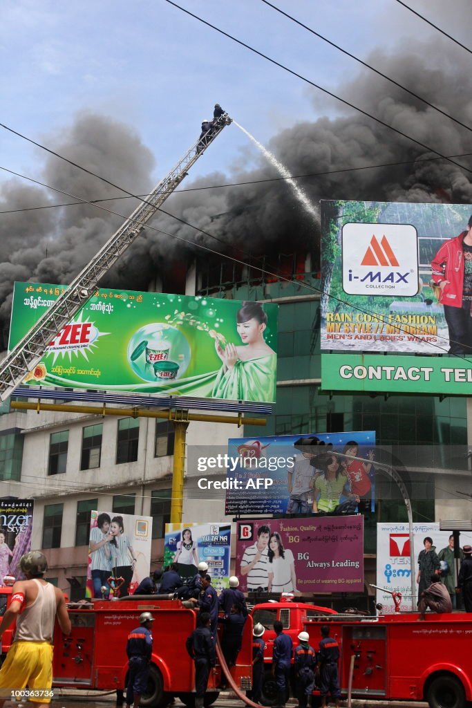 Myanmar firemen fight a blaze that broke