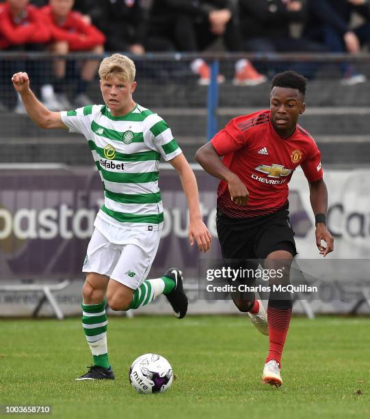 Ethan Laird of Manchester United and Scott Robertson of Celtic during the U19 NI Super Cup gala match at Coleraine Showgrounds on July 21, 2018 in...