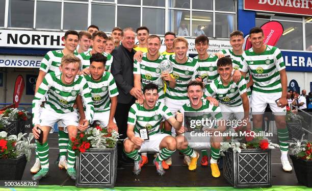 Gerry Armstrong presents the challenge trophy to Celtic following the U19 NI Super Cup gala match between Manchester United and Celtic at Coleraine...