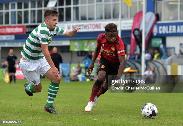 Largie Ramazani of Manchester United and Lewis Bell of Celtic during the U19 NI Super Cup gala match at Coleraine Showgrounds on July 21, 2018 in...