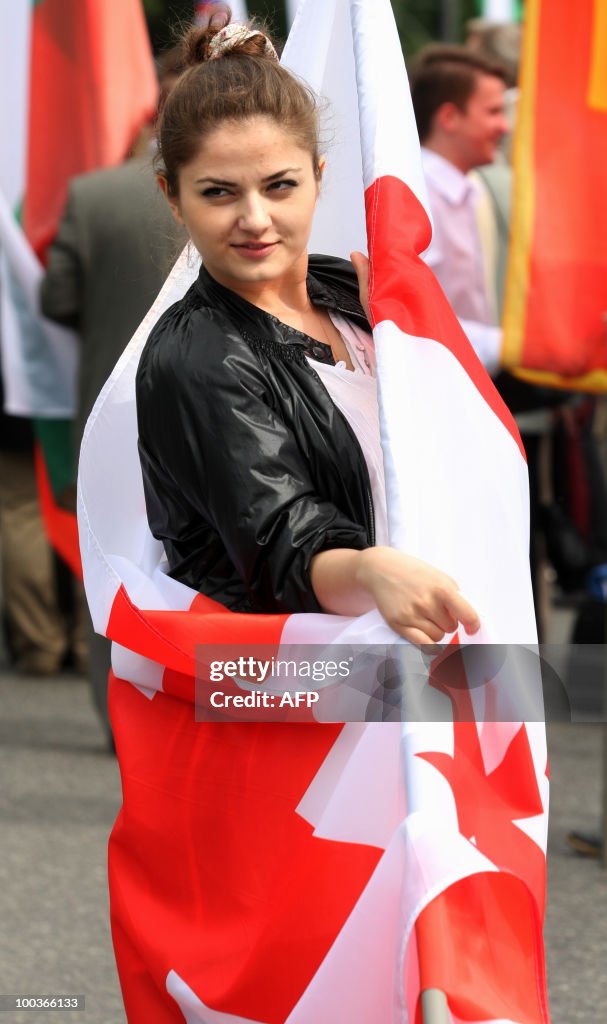 A girl draped in the Georgian flag parti