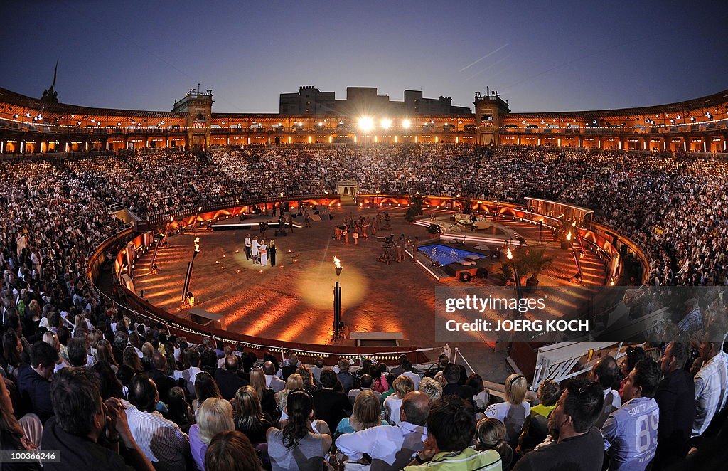 Spectators watch the television show "We