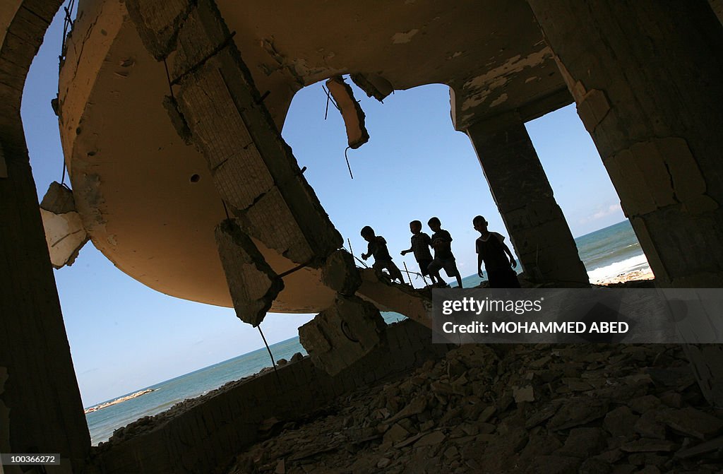 Palestinian children play inside a build