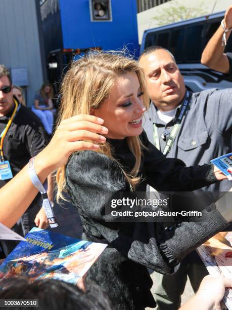 Amber Heard is seen attending DC Entertainment's Warner Bros. Pictures 'Aquaman' Autograph Signing during Comic-Con International 2018 at San Diego...