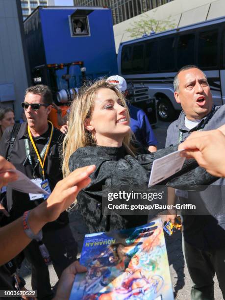 Amber Heard is seen attending DC Entertainment's Warner Bros. Pictures 'Aquaman' Autograph Signing during Comic-Con International 2018 at San Diego...