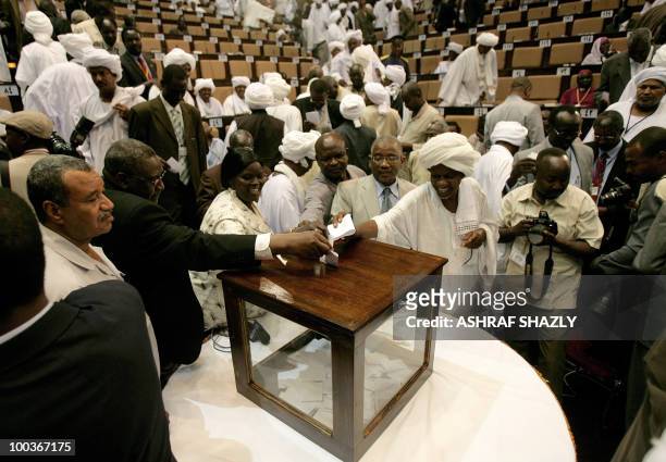Members of the Sudanese Parliament vote for a new speaker during a gathering of the new of Parliament in Khartoum on May 24, 2010. Sudan's new...