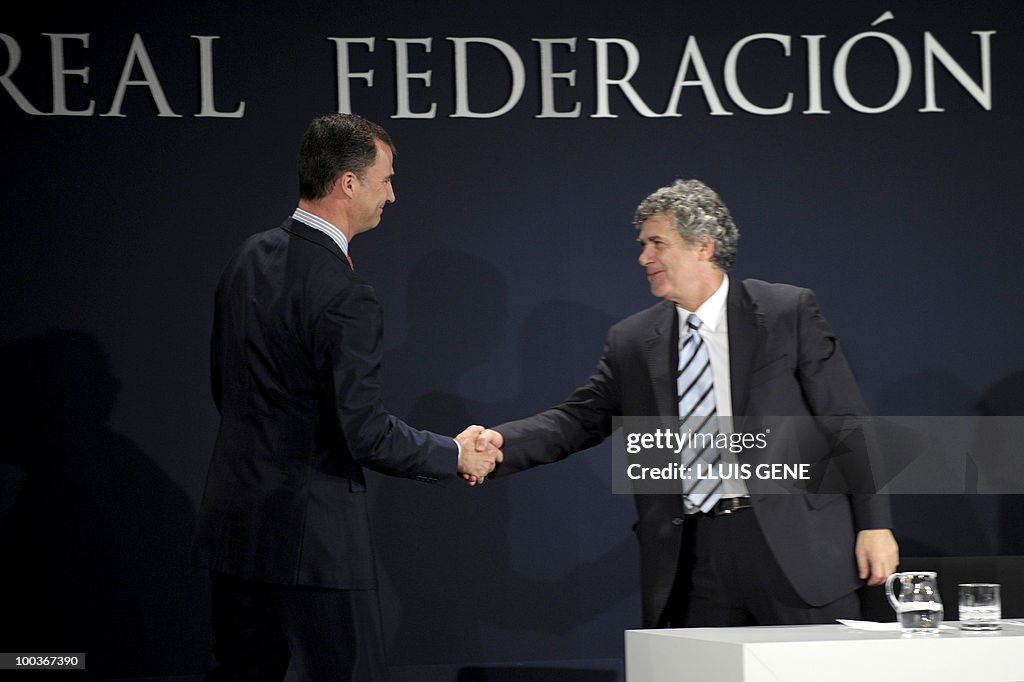 Spain's Prince Felipe (L) shakes hands w