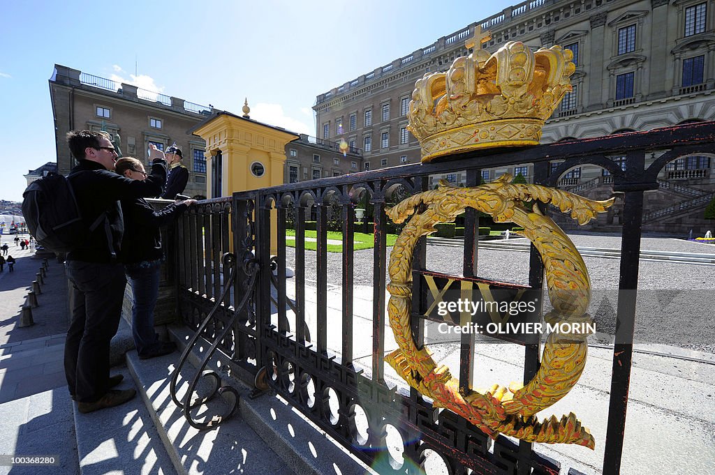 A tourist takes pictures as he stands op