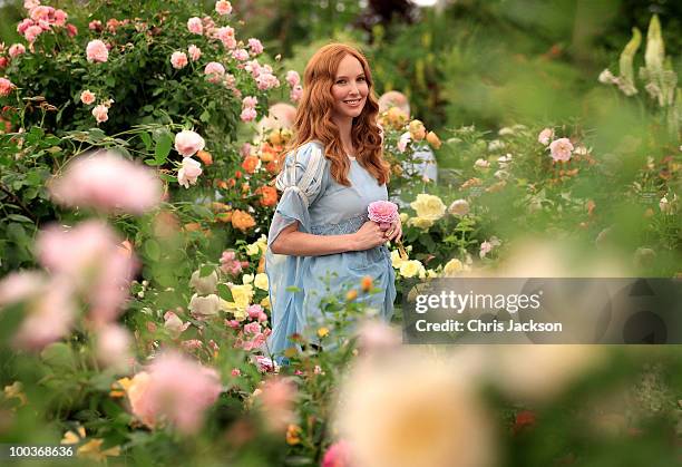 Model poses in the David Austen Rose garden at the Press & VIP preview at The Chelsea Flower Show at Royal Hospital Chelsea on May 24, 2010 in...