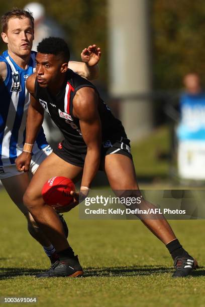 Aloysio Ferriera of Frankston handballs during the round 16 VFL match between Frankston and North Melbourne at SkyBus Stadium on July 22, 2018 in...