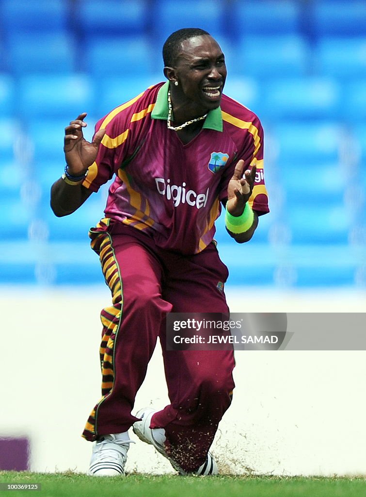 West Indies cricketer Dwayne Bravo react