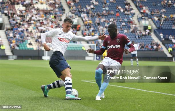 Preston North End's Josh Earl and West Ham United's Arthur Masuaku at Deepdale on July 21, 2018 in Preston, England.