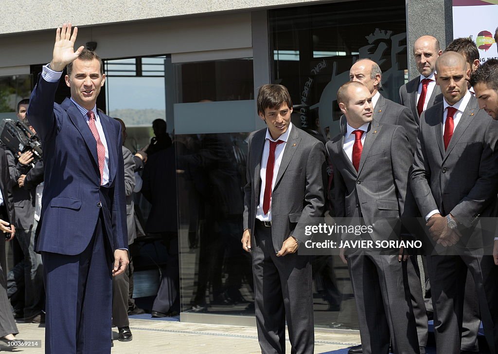 Spain's Prince Felipe (L) waves after a